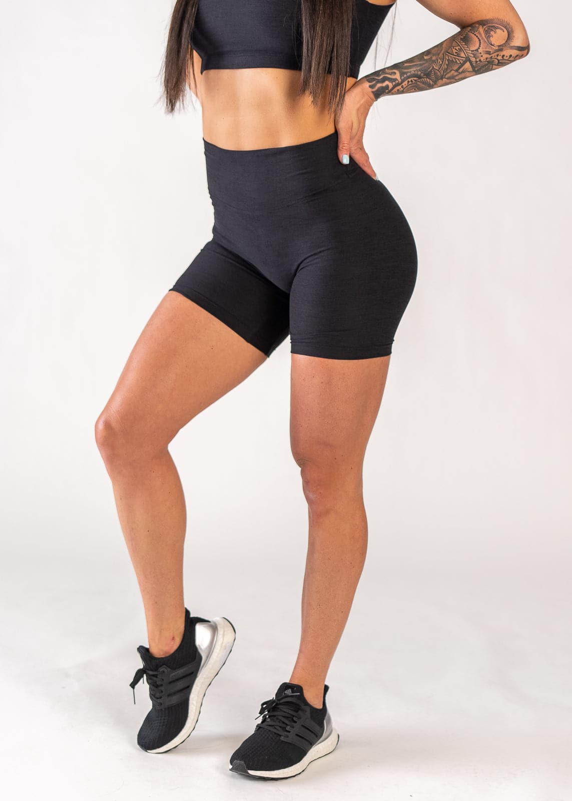 Chest Down 3/4 Side View One Leg Up Wearing Dream 6" Shorts | Black TBD