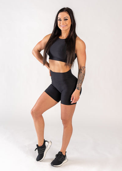Full Body 3/4 Front View One Leg Up and One Hand on Hip Wearing Dream 6" Shorts | Black TBD