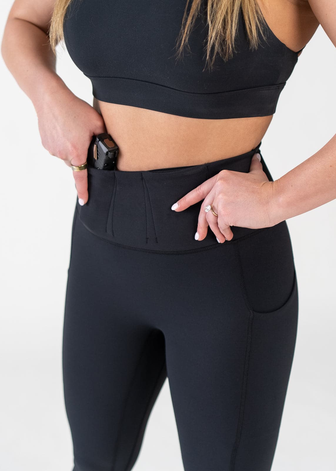 Concealed Carry Leggings With Built-in Band 3/4 Front View Close Up with Hands on Hips | Black