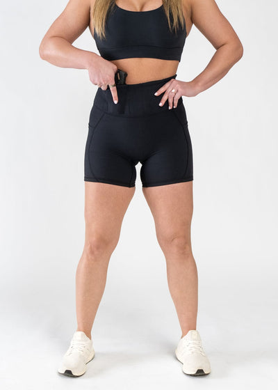 Shoulders Down Front View Reaching for Concealed Carry - Concealed Carry Shorts With Pockets | Black