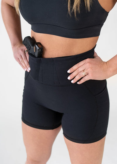Close Up Shoulders Down 3/4 Front View with Hands on Sides Concealed Carry Leggings | Black