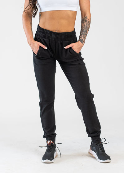 Black Boyfriend Joggers Hands in Pockets with White Crop Bra - Front View