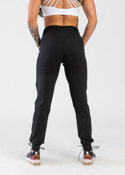 Black Boyfriend Joggers Hands Behind Back with White Crop Bra - Front View
