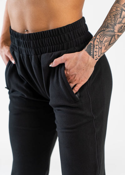 Black Boyfriend Joggers Hands in Pockets Front 3/4 View Close Up on Waist Band and Thighs