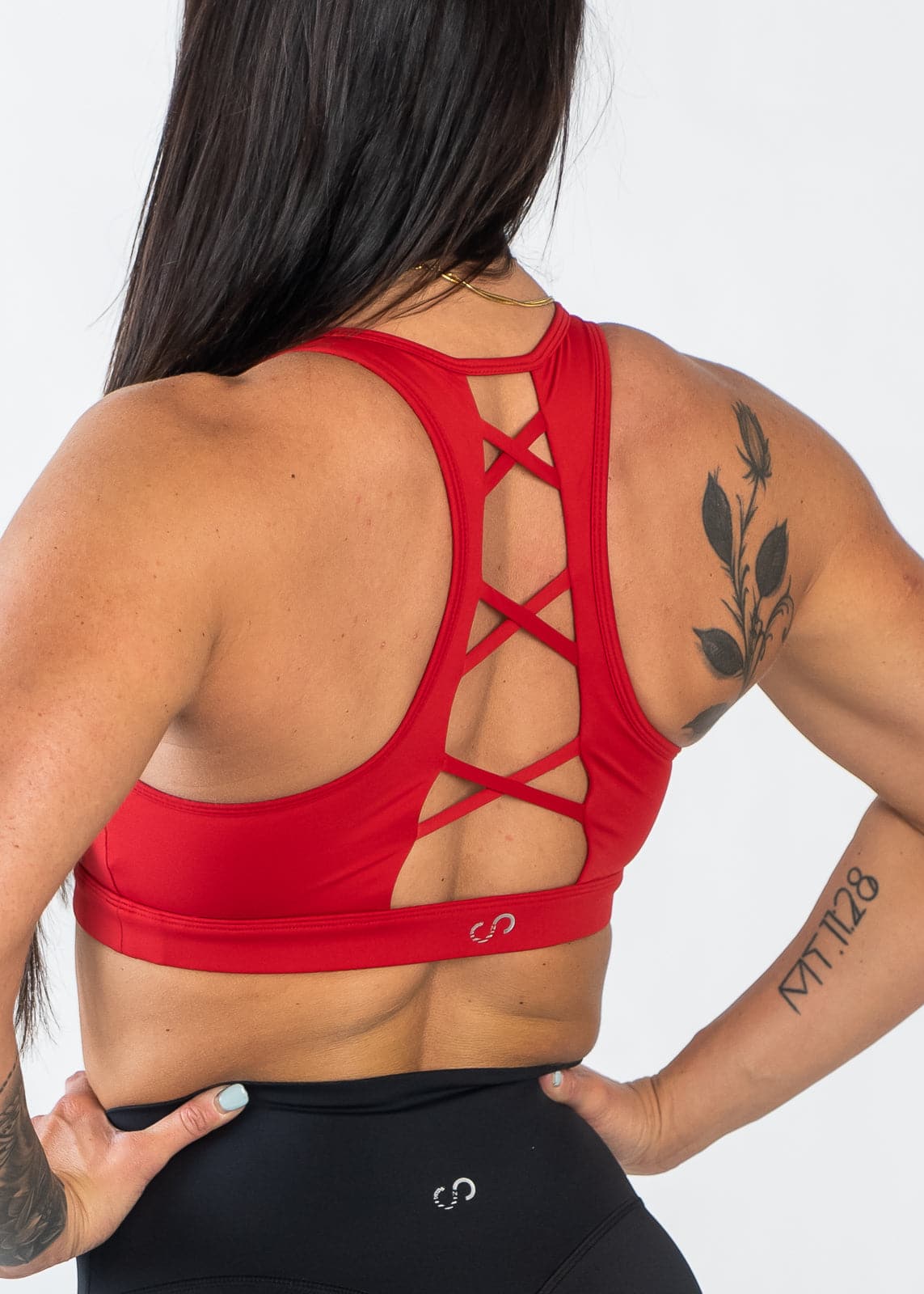 Chin to Waist with Hands on Hips Wearing Empowered Laced Back Sports Bra | Red