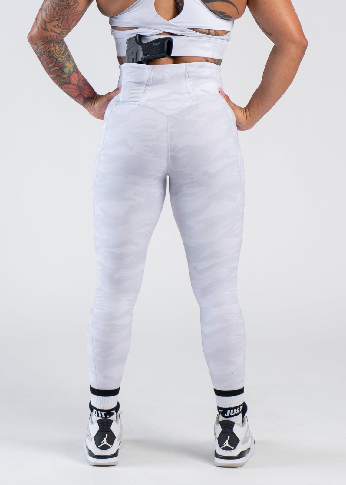 Concealed Carry Leggings With Pockets Shoulders Down Back View with Hands on Sides | Snow Camo