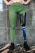 Front view of left leg above the knee amputee leggings with pockets-Military Green.