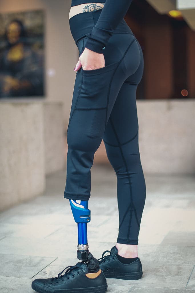 Left side view of left leg below the knee amputee leggings with pockets-Black.
