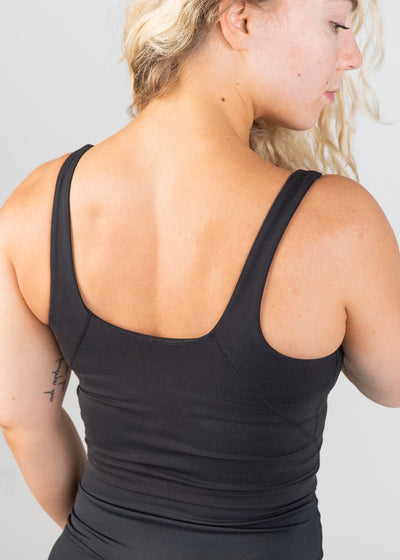 Waist Up 3/4 Back View Wearing CRVS Crop Bra | Black