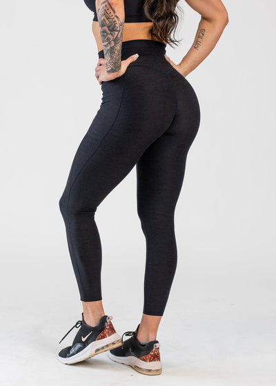 Chest Down 3/4 Back View With Hands on Hips Wearing Dream Leggings With Pockets | Black