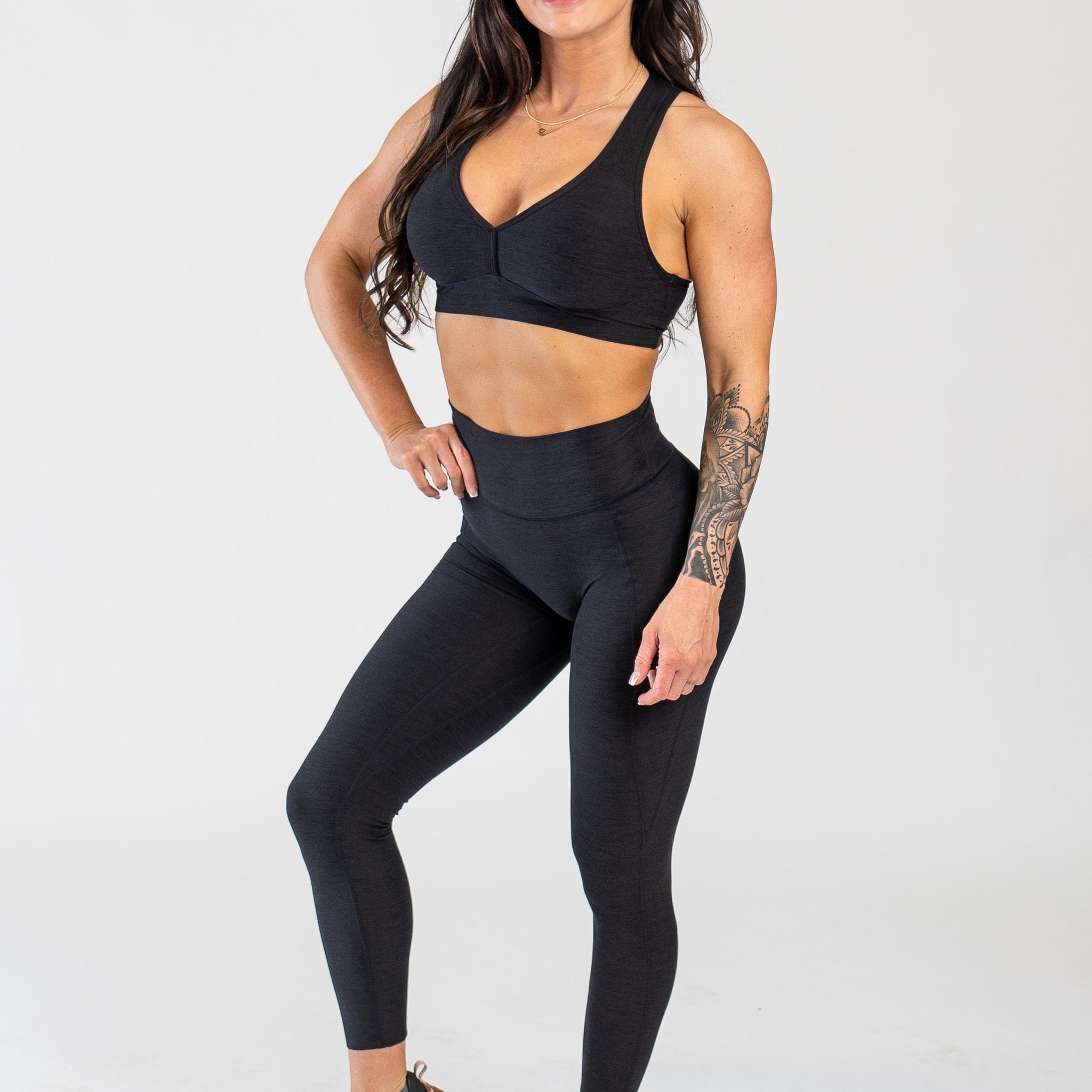 Full Body 3/4 Front Facing View With One Hand on Hip Wearing Dream Leggings With Pockets | Black