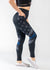 Chest Down Side View Wearing Empowered Leggings with one Hand in Pocket | Blue Line