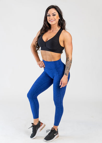 Full Body 3/4 Front Facing View With One Hand on Hip Wearing Dream Leggings With Pockets | Blue Razz