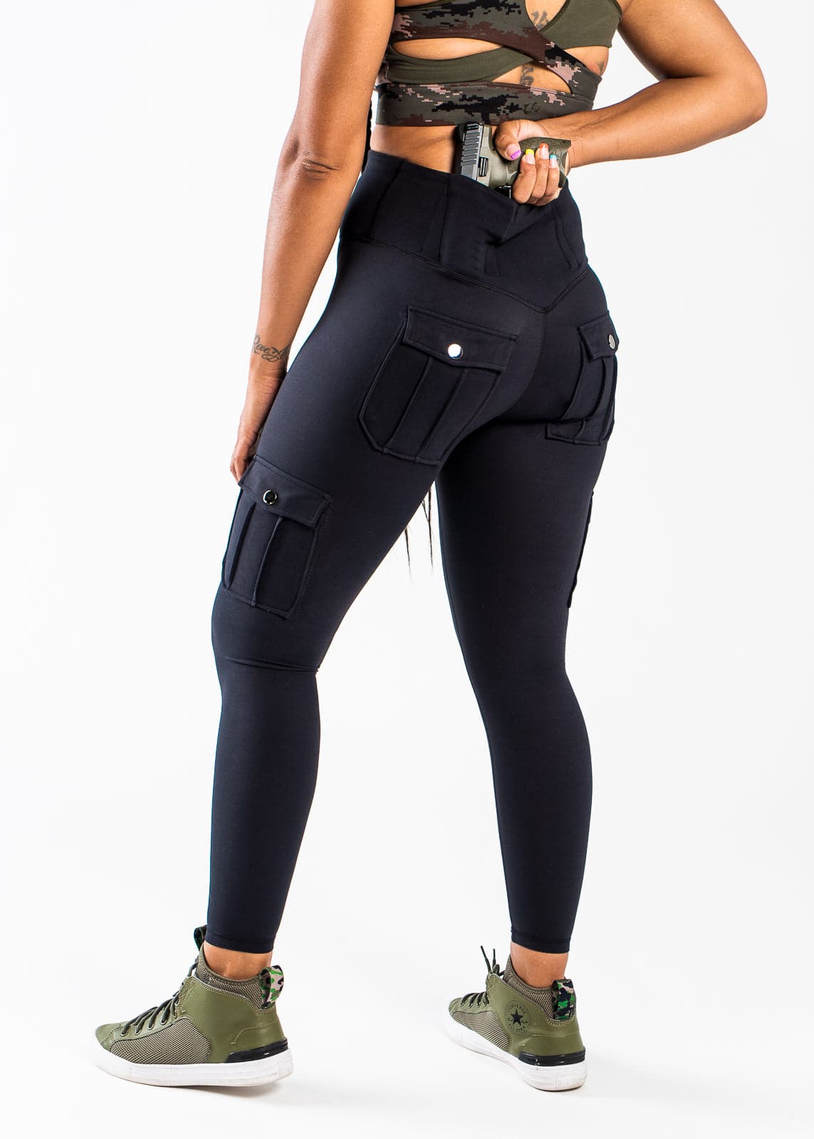 Concealed Carry Leggings With Tactical Pockets Shoulders Down 3/4 Back View Reaching for Concealed Carry | Black