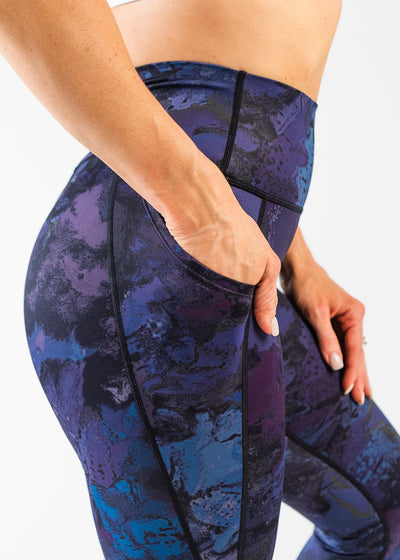 Close Up Waist to Knee Side View with Hand in Pocket Wearing Empowered Leggings | Galaxy