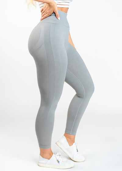 Chest Down Side View in Contour Seamless Leggings with One Leg Up - Ash