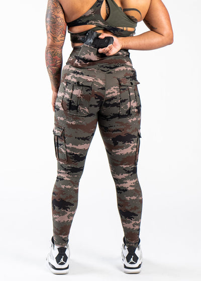 Shoulders Down Back View Reaching for Concealed Carry - Concealed Carry Leggings | Green Camo