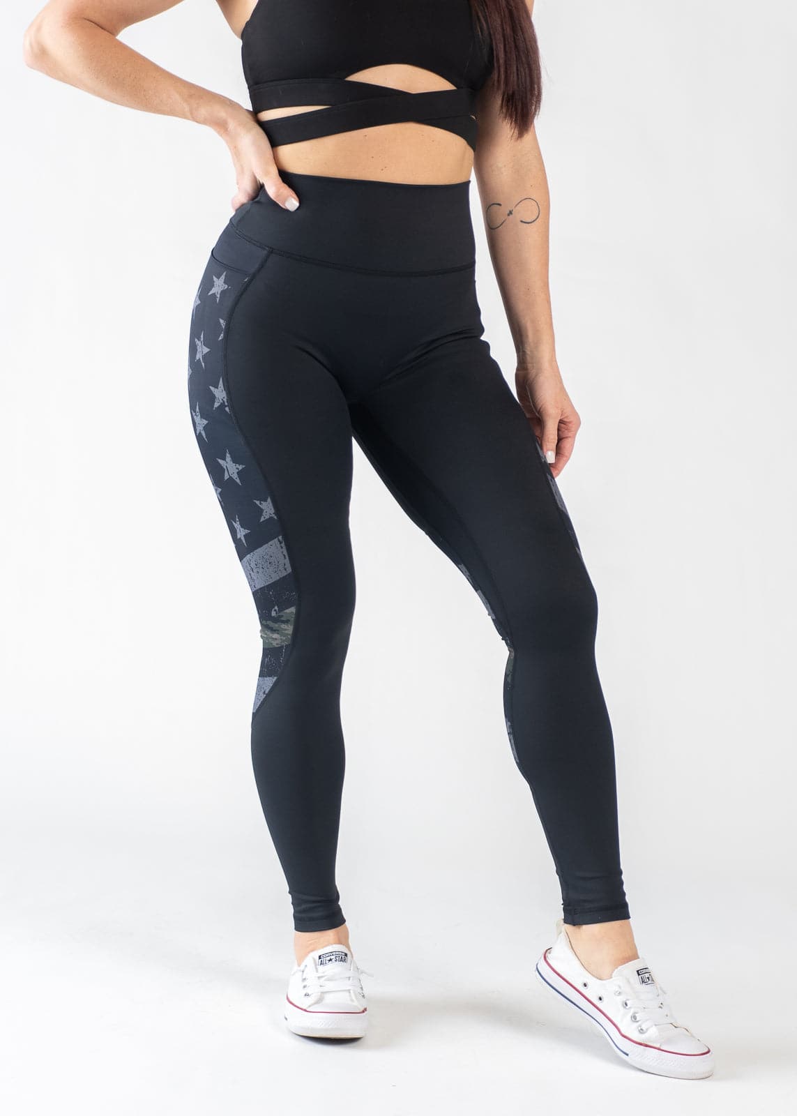 Chest Down Front View with Hand on Lower Back Wearing Empowered Leggings | Camo Line