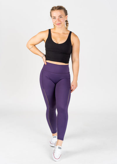 Full Body Front Facing One Hand on Hip Wearing Empowered Leggings With Cut Outs | Purple