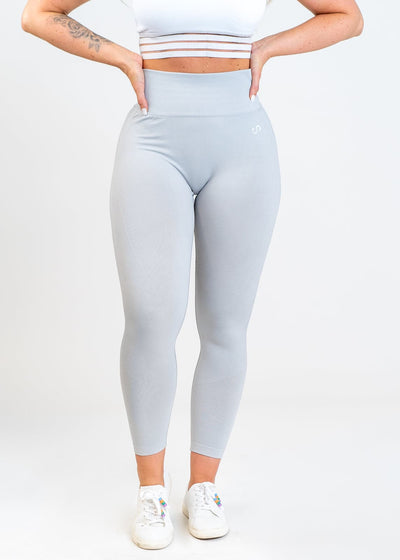 Chest Down Front View with Hands on Back in Contour Seamless Leggings - Ice