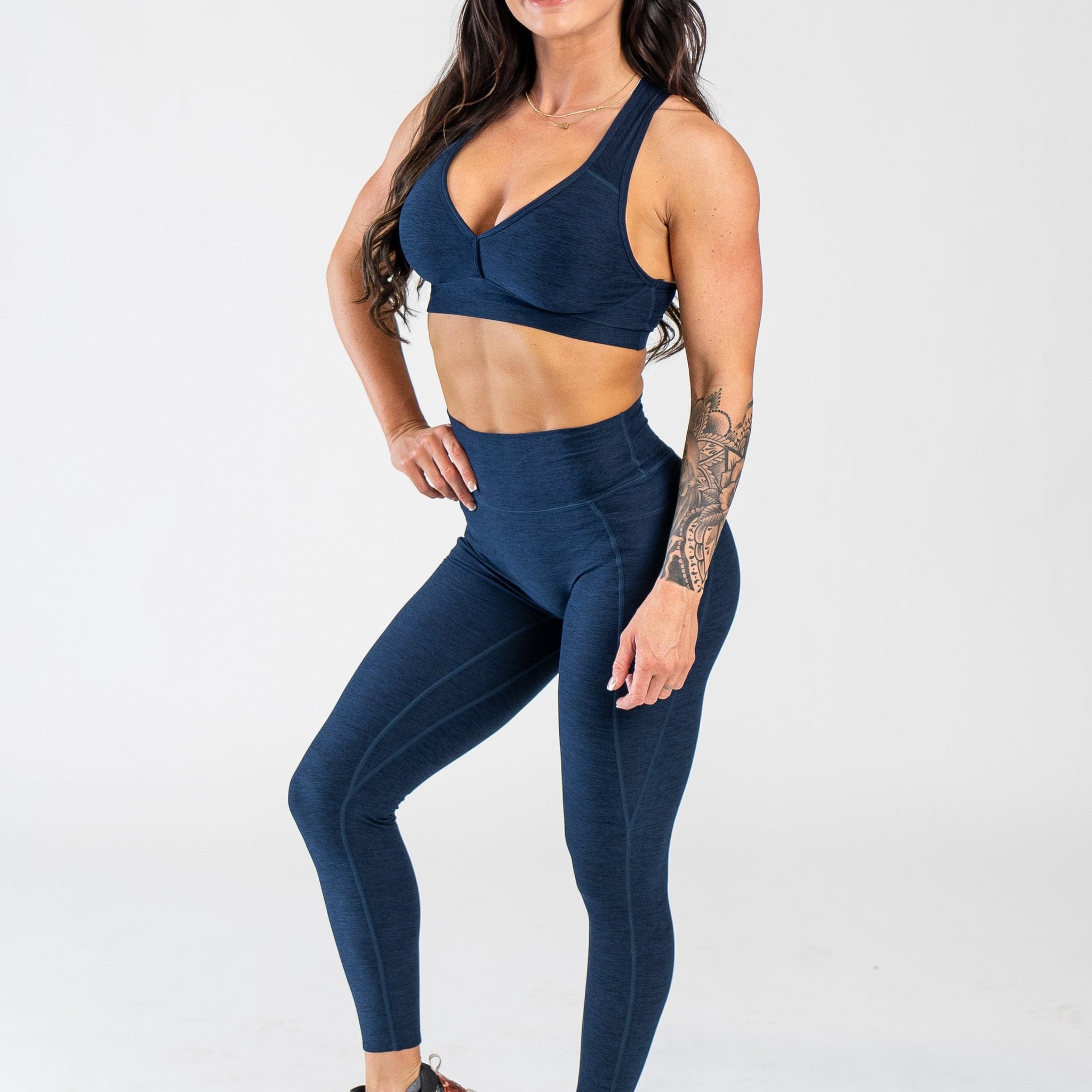 Full Body 3/4 Front Facing View With One Hand on Hip Wearing Dream Leggings With Pockets | Deep Blue