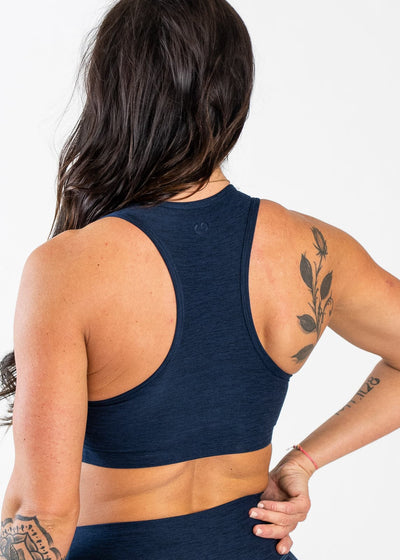 Waist Up 3/4 Back View Racerback Wearing Dream Bra | Deep Blue