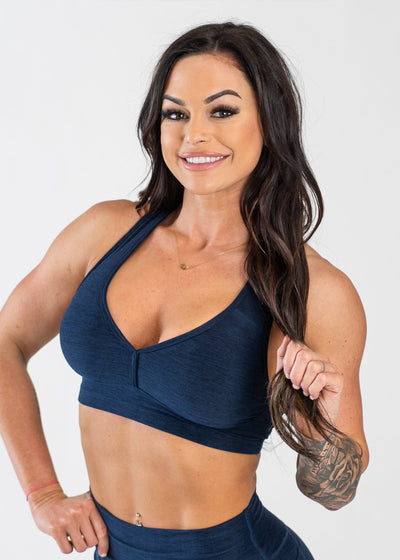Waist Up 3/4 Front View One Hand Holding Hair Wearing Dream Bra | Deep Blue