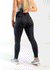 Concealed Carry Leggings With Pockets Shoulders Down 3/4 Back View Reaching for Concealed Carry | Holographic Rain