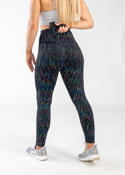 Concealed Carry Leggings With Pockets Shoulders Down 3/4 Back View Reaching for Concealed Carry | Holographic Rain