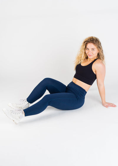 Full Body 3/4 Side View Legs Out and Upper Body Angled Wearing Empowered Double Brushed Leggings - Navy Blue