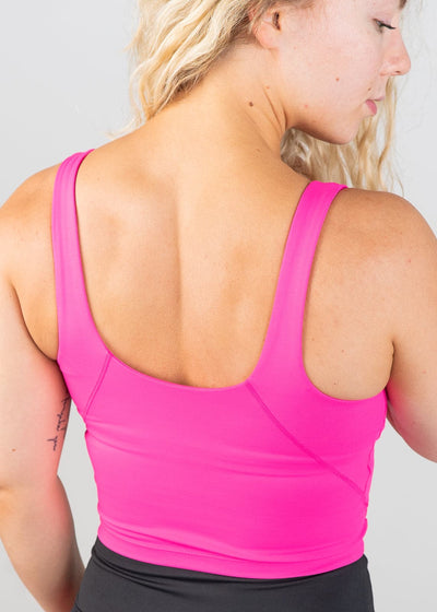 Waist Up 3/4 Back View Wearing CRVS Crop Bra | Hot Pink