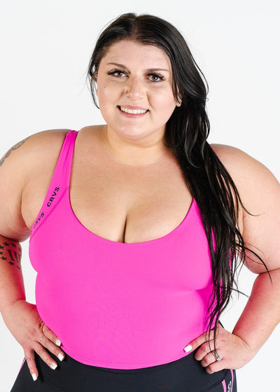 Waist Up Front View Hands on Hips Plus Sized Model Wearing CRVS Crop Bra | Hot Pink