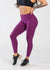 Chest Down 3/4 Front View With One Hand on Lower Back Wearing Dream Leggings With Pockets | Raspberry