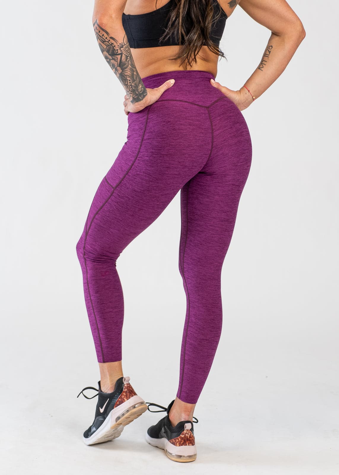 Chest Down 3/4 Back View With Hands on Hips Wearing Dream Leggings With Pockets | Raspberry