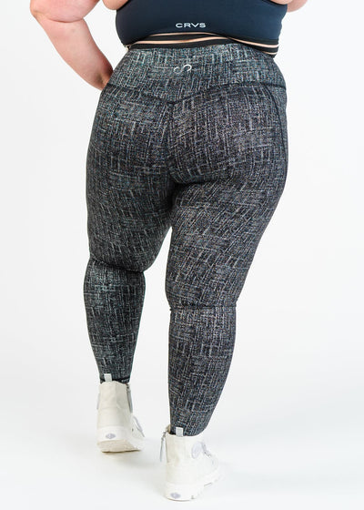 Chest Down Back View Plus Sized Model Wearing Empowered Leggings With Pockets | Black/Silver