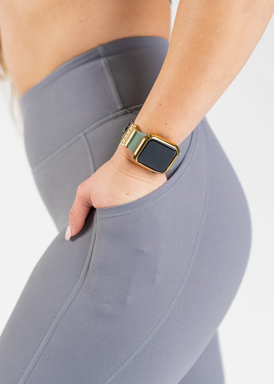 Chest to Thighs Side View Close Up with One Hand in Pocket Wearing Empowered Double Brushed Leggings - Slate