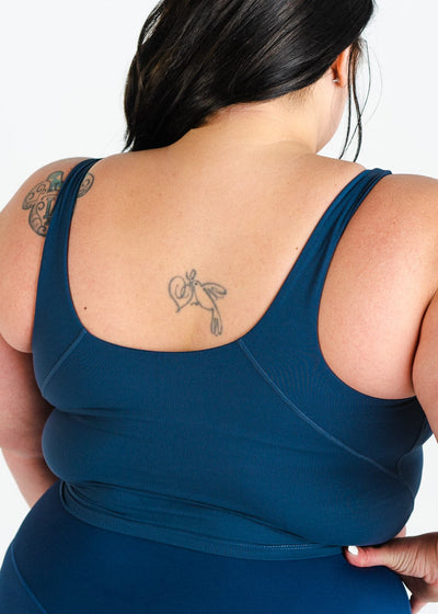Waist Up SBack View Hands on Hips Plus Sized Model Wearing CRVS Crop Bra | Navy Blue